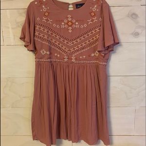 Pink dress with orange and white details